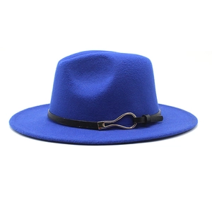 Close-up of royal blue fedora hat featuring a black faux leather band and silver buckle