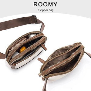Cream white crossbody fanny pack with three zipper pockets and wide fabric strap