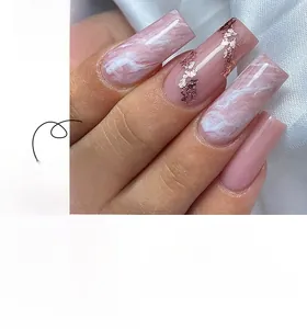 Detail view of long coffin press-on nails with pink marble dye and gold foil accents