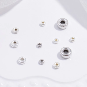 Macro shot of 925 sterling silver loose barrel spacer beads for DIY jewelry making