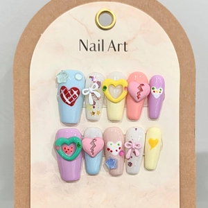 Handmade press-on nails with colorful 3D heart and bow designs in macaron tones