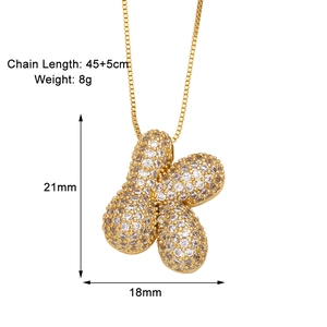 Macro detail of gold plated necklace with zircon pendant measuring 21mm by 18mm
