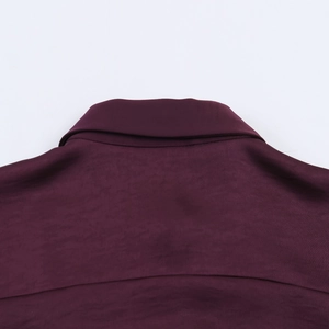 Detail shot showing the glossy satin fabric and back collar seam of the burgundy shirt