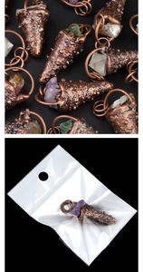 Detail view of vintage bronze amethyst pendants and individual crystal packaging