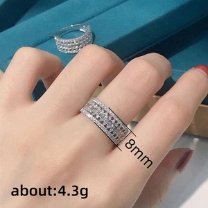 Exquisite 8mm wide silver-plated copper ring with multi-row pavé crystals on finger