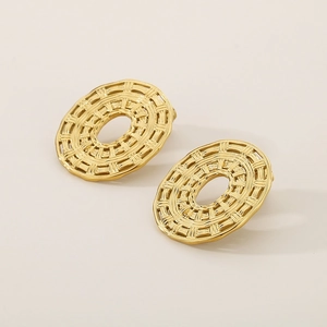 Detailed macro view of woven oval 18K gold plated earrings with radiating texture
