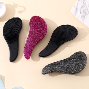 Starry massage detangling hairbrush set in black and pink glitter with S-shaped ergonomic design