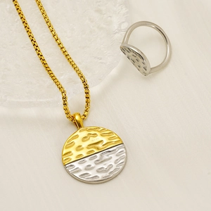 Two-tone hammered metal jewelry set with gold box chain necklace and silver dome ring