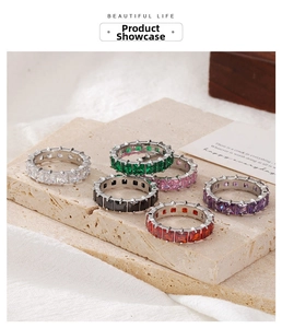 Macro view of colorful square cut eternity rings in a premium lifestyle display