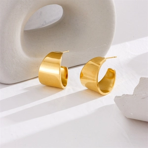 Polished gold wide C-shaped hoop earrings in a minimalist stainless steel style