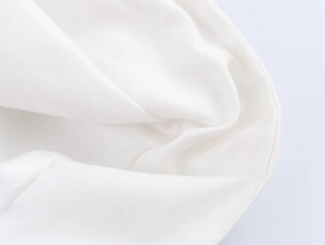 Detail shot of the white high-density canvas fabric texture and professional stitching