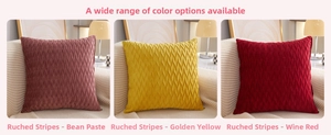 Detail of crushed velvet pillow covers in bean paste, gold, and wine red colors
