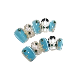 Handmade press-on nails with blue cat-eye effect and silver metallic textured finish