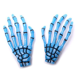 Detail view of blue Harajuku gothic skull hand hair clips in a pair for Halloween style