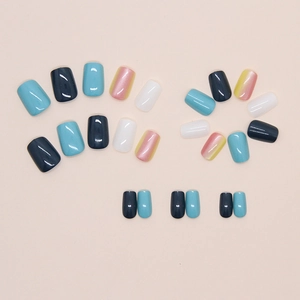 Flat lay showing 24pcs short square press-on nails in blue, white, and gradient pearlescent