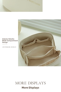 Detail view of cream leather cosmetic bag showing large zipper opening and internal compartments