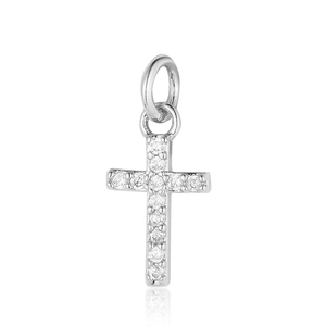 Macro shot of silver cross pendant with clear cubic zirconia stones and top loop