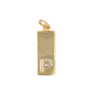 Close-up of golden rectangular pendant with sparkling zircon letter P inlay detail
