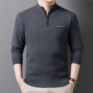Detailed view of dark grey men's knitwear with mock neck zipper and fine ribbed texture