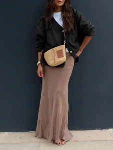 Women's casual black long sleeve knit cardigan with white T-shirt and brown long skirt