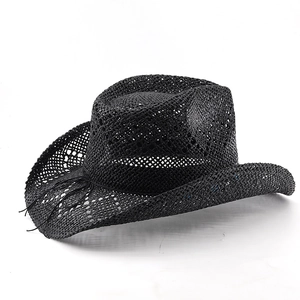 Detailed view of black woven cowboy straw hat featuring breathable hollow patterns