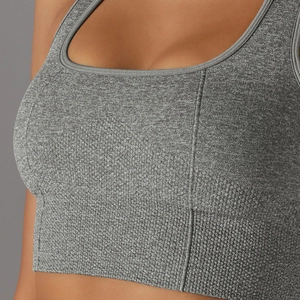 Detail of grey seamless knitted sports bra showing honeycomb texture and flat seams