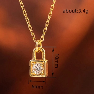 French fashion gold lock necklace with a single sparkling cubic zirconia pendant