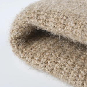Thick beige wool knit beanie with double-cuffed design for winter warmth and style