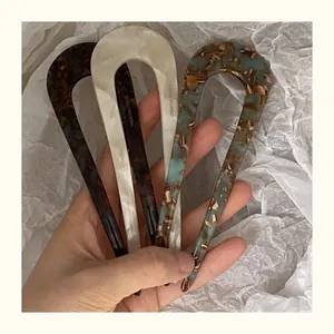 Three-piece acetate U-shaped hair pins set in tortoiseshell, pearl white, and blue patterns