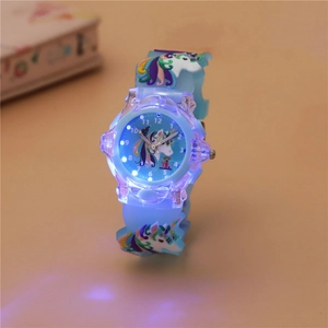 Close-up of kids' glowing watch with unicorn pattern and blue LED light effects