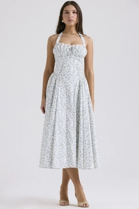 Detail of floral halter neck dress featuring front tie lace-up and shirred bodice design
