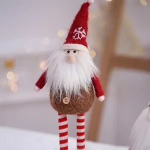 Handmade wool felt Santa gnome ornament with red snowflake hat and striped legs