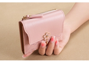 Pink PU leather compact wallet featuring diamond embroidery and a gold floral metal clasp