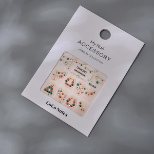3D Christmas nail stickers with K9 rhinestones and festive trees in retail packaging