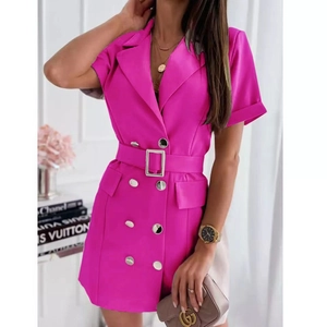 Detail of waist belt with square buckle and silver buttons on pink blazer dress