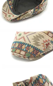 Close-up of ethnic jacquard pattern fabric and reinforced brim details of the flat cap