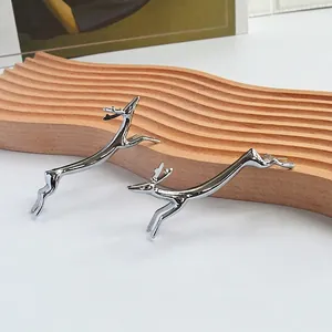 Set of two silver deer shaped metal chopstick rests with polished mirror finish