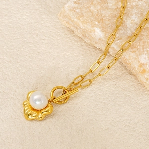 French vintage gold necklace with white pearl flower pendant and OT toggle clasp