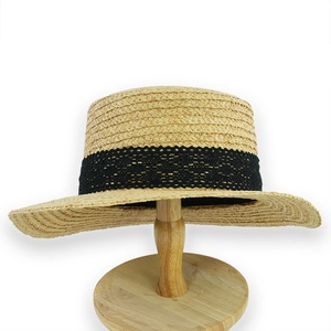 Straw boater hat in beige with black lace trim and round wooden display stand
