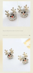 Macro detail of Christmas reindeer earrings with sparkling rhinestones and gold finish