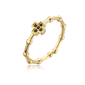 Macro view of 18K gold plated cross ring featuring black zircons and bamboo style band