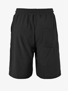 Detail view of black waffle knit casual shorts showing elastic waist and back pocket