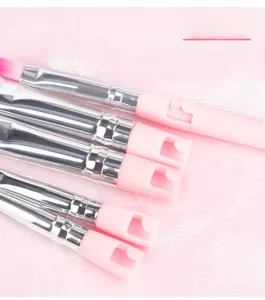 Close-up of pink travel makeup brush handle showing the secure clip-in connection detail