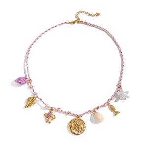 Detail of bohemian woven necklace featuring purple seashell, sea turtle and sun pendants