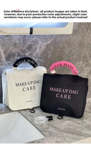 Detail of white makeup bag with pearl handle and stylish logo on marble background