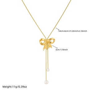 Gold bow pearl pendant necklace with stainless steel snake chain and tassel detail