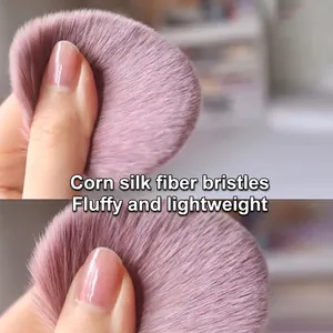 Soft dusty pink makeup brush head with dense corn fiber bristles and high resilience