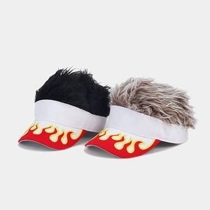 Detail of creative visor hats with flame embroidery and synthetic wig hair in two colors