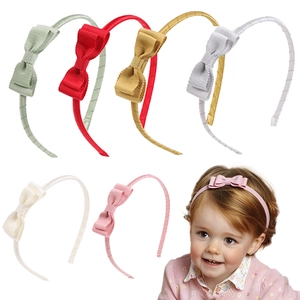 Detail of colorful grosgrain ribbon bow headbands for girls in six different pastel colors