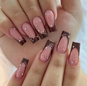 Brown French tip long coffin press-on nails with white heart outlines and rhinestones